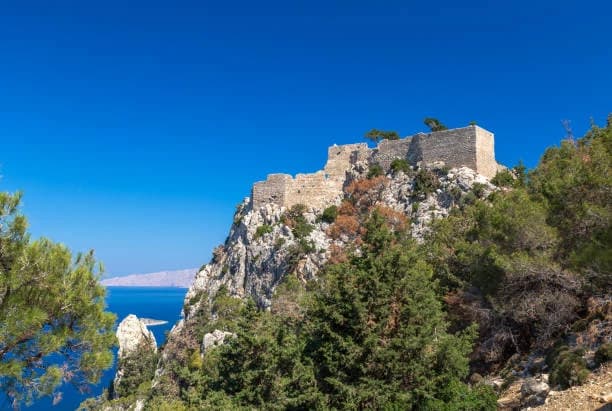 Kritinia Castle on its crag above the western coast