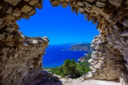 View through a Kritinia Castle window out to the blue sea