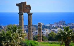 Temple of Apollo columns on Monte Smith above the city and sea