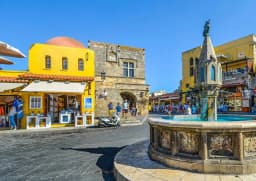 Hippocrates Square with the Sea Gate and fountain in the Old Town